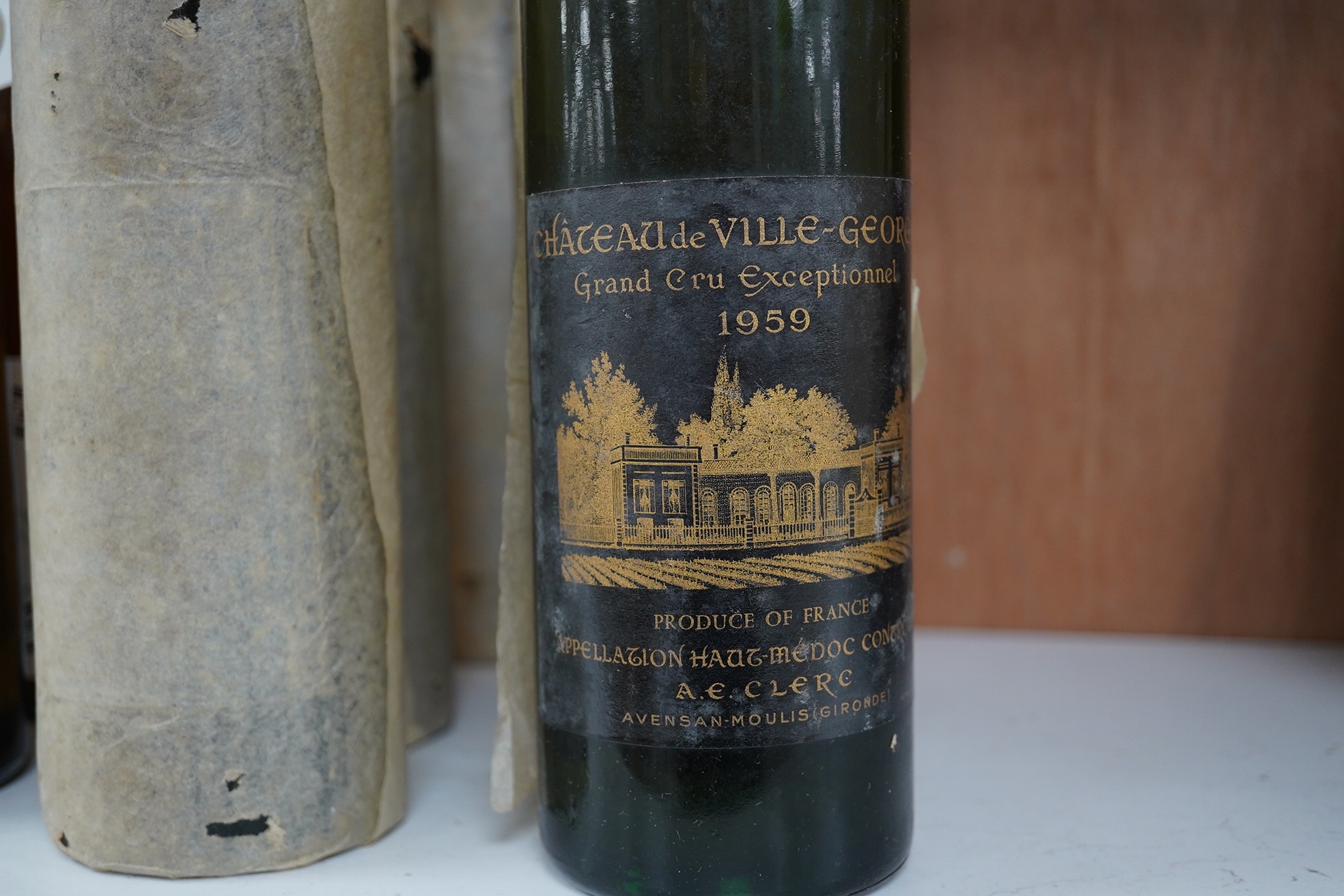 Twelve bottles of wine; six bottles of 1959 Chateau de Ville-George Grand Cru Exceptionnel and six bottles of Georges Duboeuf Macon Prisse 1977. Condition - fair to good